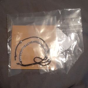 A morse code bracelet reads"fuck off"